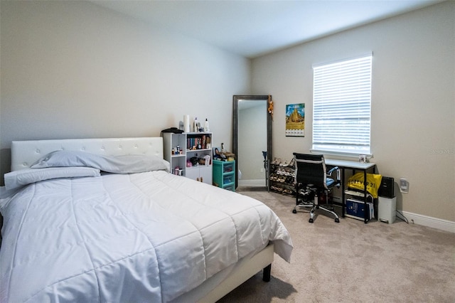 bedroom featuring light carpet