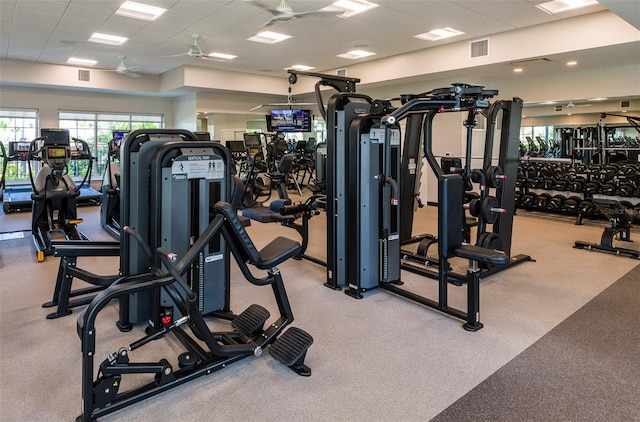 gym with light carpet and ceiling fan