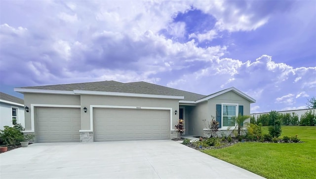 ranch-style house with a front yard and a garage