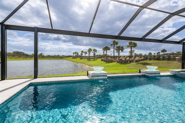 view of pool featuring glass enclosure, a water view, and a yard