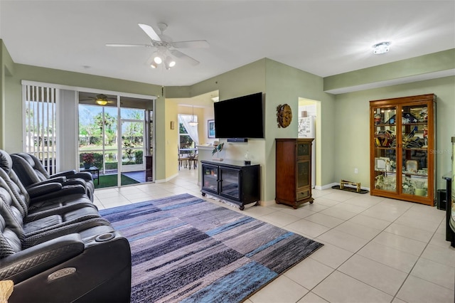 living room featuring light tile patterned floors and ceiling fan