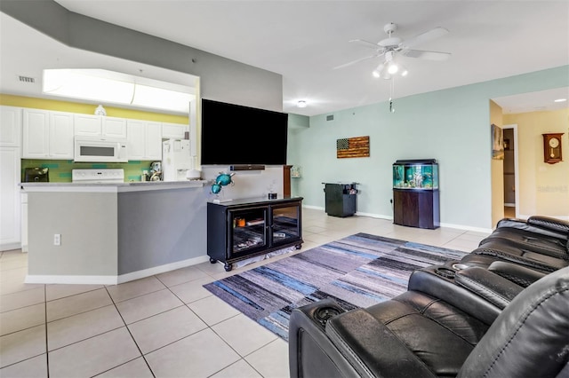 tiled living room featuring ceiling fan