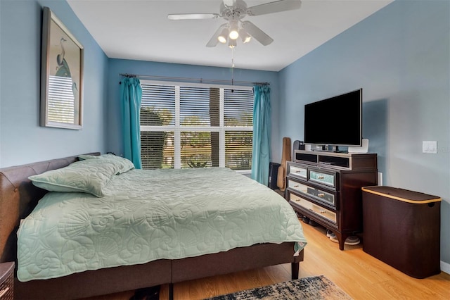 bedroom with light wood-type flooring and ceiling fan