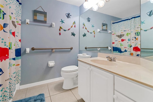 bathroom with vanity, tile patterned floors, and toilet