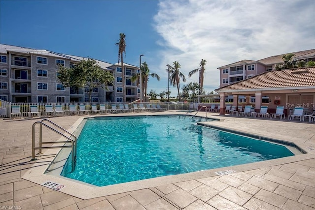 view of swimming pool featuring a patio area