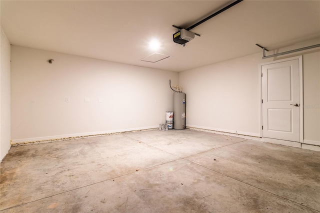 garage featuring electric water heater and a garage door opener