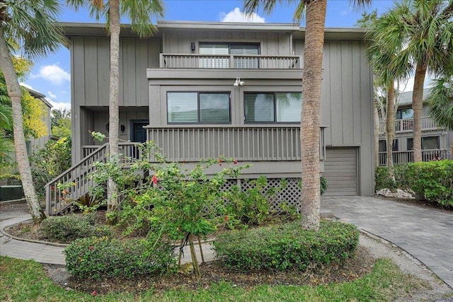 view of front of property with a balcony and a garage