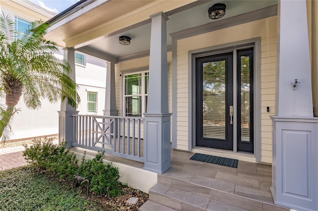 property entrance with covered porch