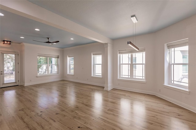 interior space with ceiling fan, light wood-type flooring, and crown molding