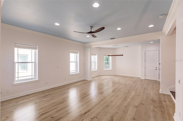 unfurnished room with ceiling fan, ornamental molding, and light hardwood / wood-style flooring