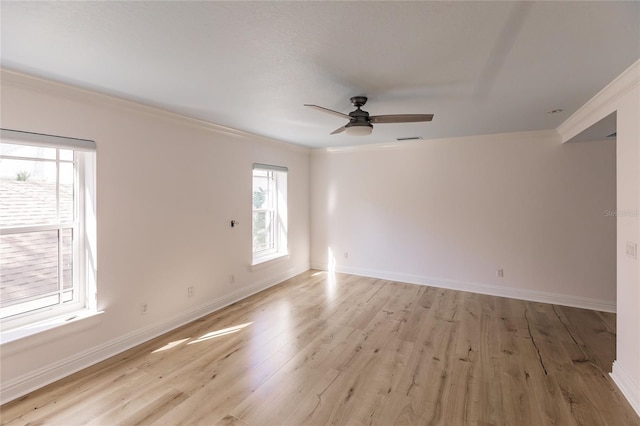 spare room with ceiling fan, light hardwood / wood-style flooring, and ornamental molding