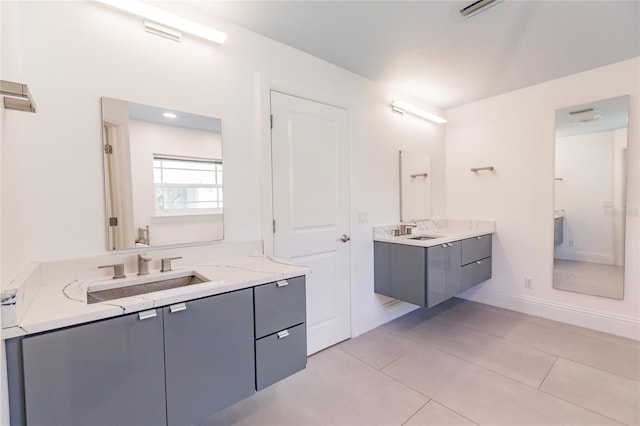 bathroom with tile patterned flooring and vanity