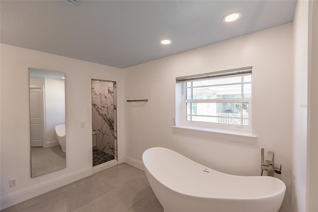 bathroom with tile patterned floors and plus walk in shower