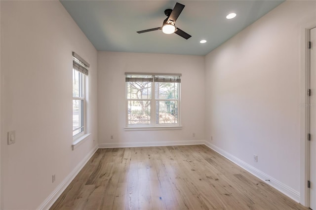 empty room with ceiling fan and light wood-type flooring