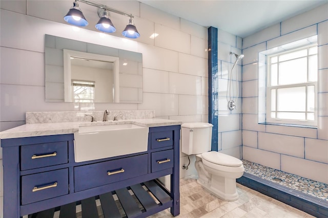 bathroom with plenty of natural light, tile walls, and tiled shower