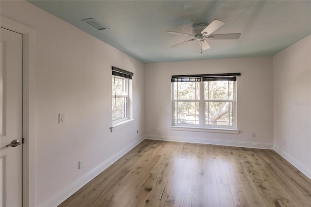 spare room with ceiling fan and light hardwood / wood-style flooring