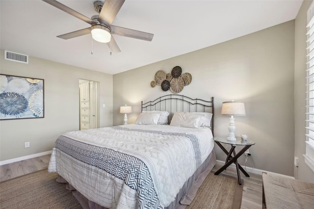 bedroom featuring light hardwood / wood-style flooring and ceiling fan