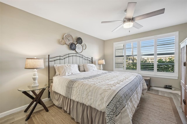 bedroom with ceiling fan and light wood-type flooring