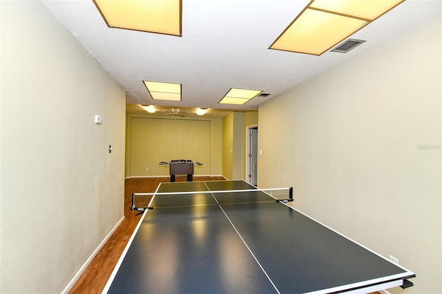 recreation room featuring dark hardwood / wood-style flooring