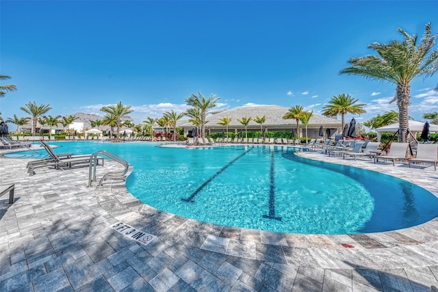 view of pool featuring a mountain view and a patio area