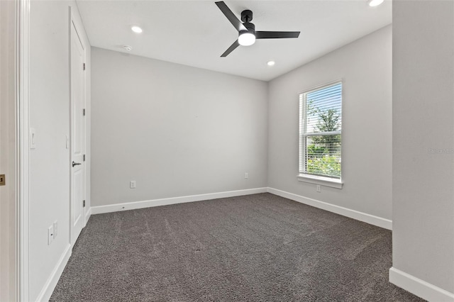 carpeted empty room featuring ceiling fan