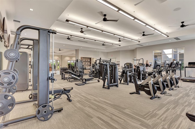 gym with light carpet and ceiling fan