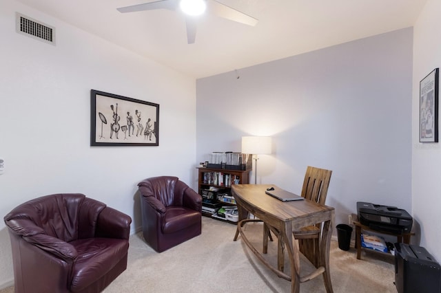 carpeted office featuring ceiling fan