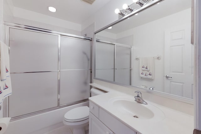 full bathroom with vanity, toilet, and combined bath / shower with glass door