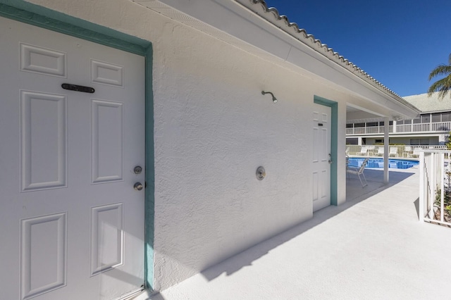 entrance to property featuring a patio