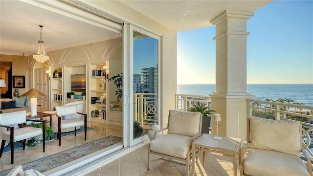 balcony featuring a water view