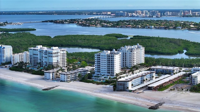 drone / aerial view with a water view and a view of the beach