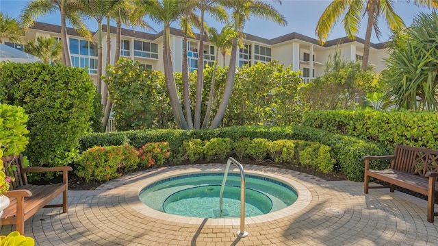 view of pool with an in ground hot tub