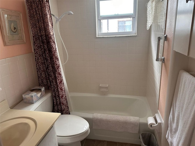611 Gulf Dr N Unit D24, Bradenton Beach, FL 34217 - full bathroom with vanity, toilet, shower / tub combo, tile walls, and a wainscoted wall