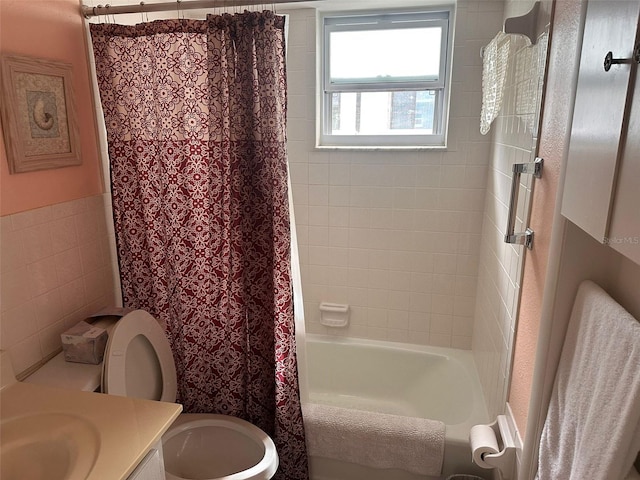 611 Gulf Dr N Unit D24, Bradenton Beach, FL 34217 - full bathroom with vanity, toilet, shower / bath combo with shower curtain, and tile walls
