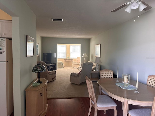 dining room featuring dark hardwood / wood-style floors and ceiling fan