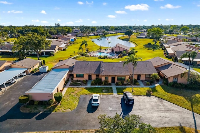aerial view of residential area featuring a nearby body of water