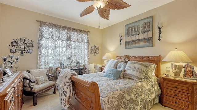 bedroom featuring ceiling fan and light carpet