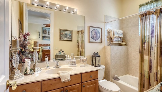 full bathroom featuring shower / tub combo, vanity, and toilet