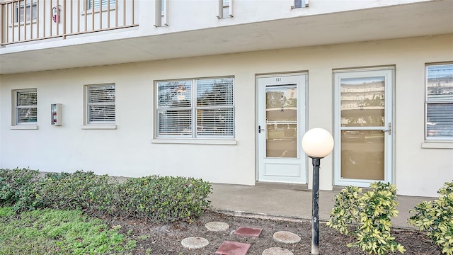 entrance to property featuring a balcony