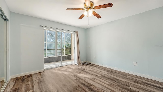 spare room with light hardwood / wood-style floors and ceiling fan