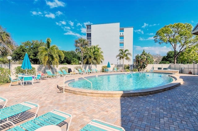 view of swimming pool with a patio