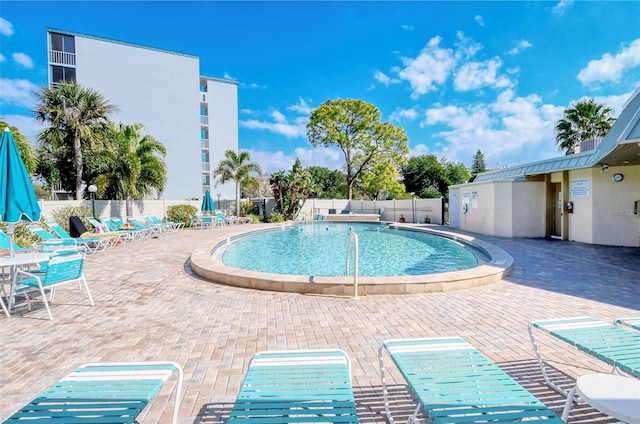 view of swimming pool featuring a patio