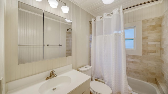 full bathroom with shower / bath combo, toilet, crown molding, and vanity