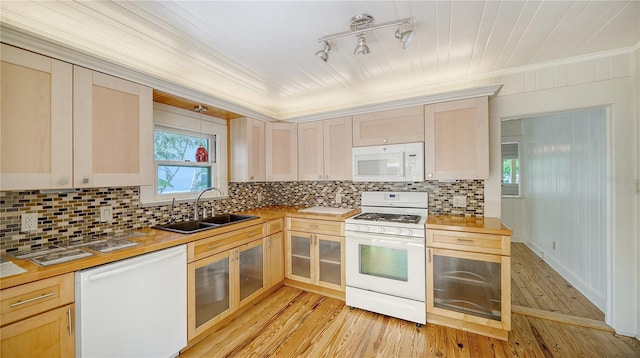 kitchen with wooden counters, a sink, crown molding, white appliances, and decorative backsplash