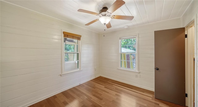 unfurnished room featuring ceiling fan and wood finished floors
