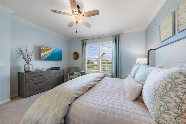 bedroom featuring ceiling fan, light carpet, and ornamental molding