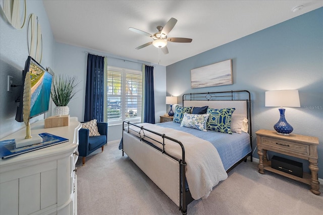 bedroom featuring ceiling fan and light colored carpet