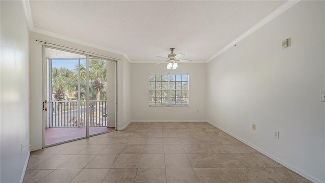 tiled spare room with a textured ceiling, ceiling fan, and crown molding