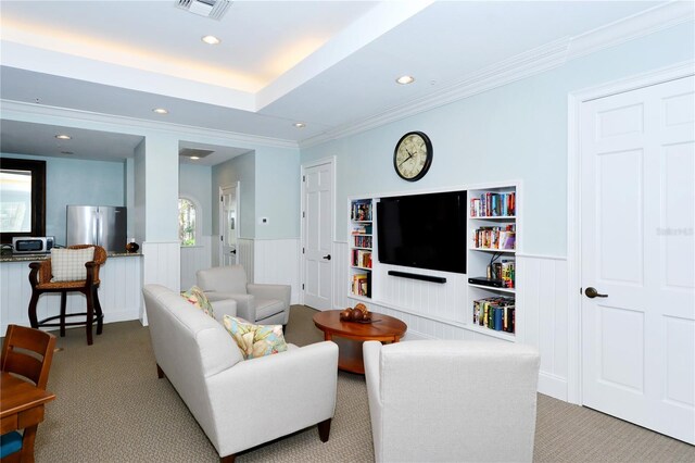 living room featuring light carpet and ornamental molding