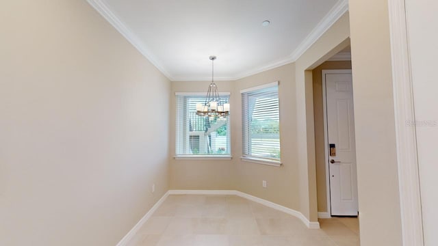 unfurnished dining area with a notable chandelier and ornamental molding